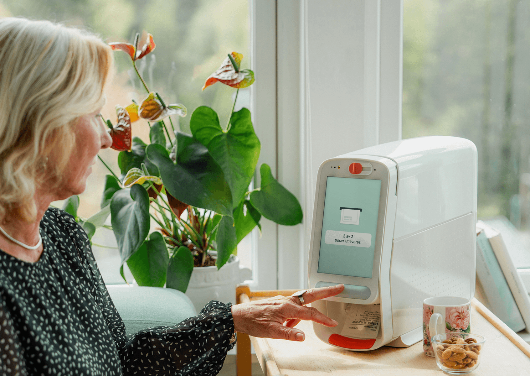 Karie Duo device next to redesigned UI screens